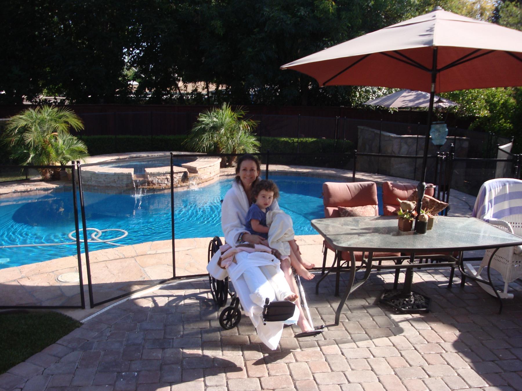 Amberly during her recovery, holding her daughter