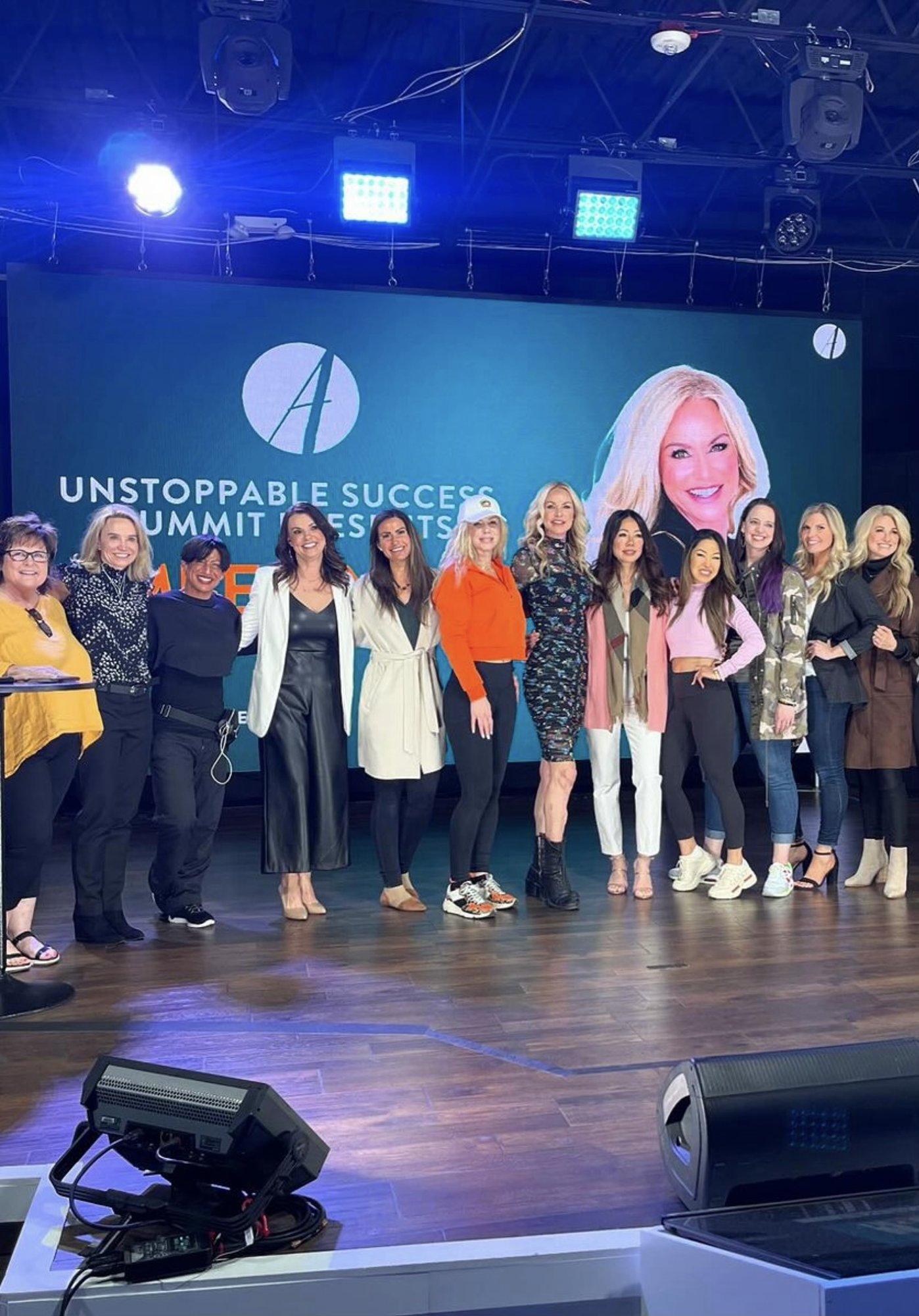 Amberly Lago on stage at the Unstoppable mastermind
