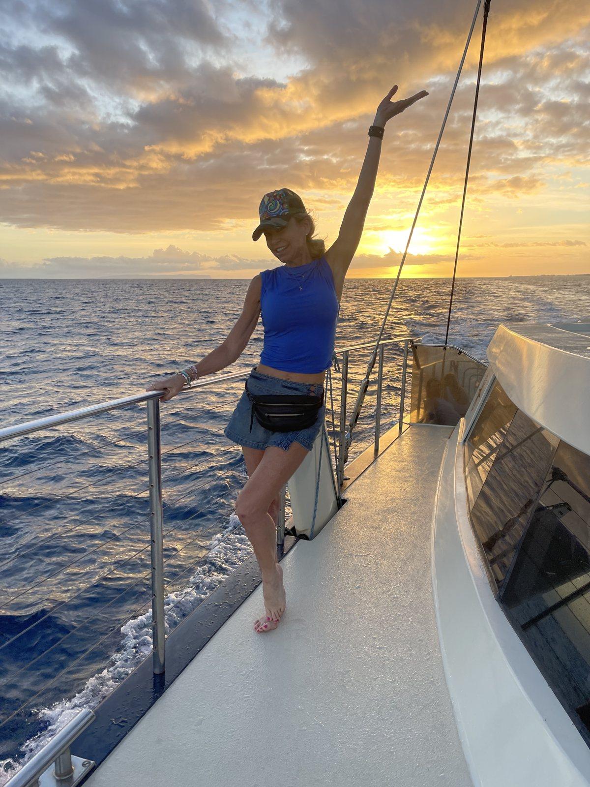 Amberly Lago at sunset on the water during a retreat