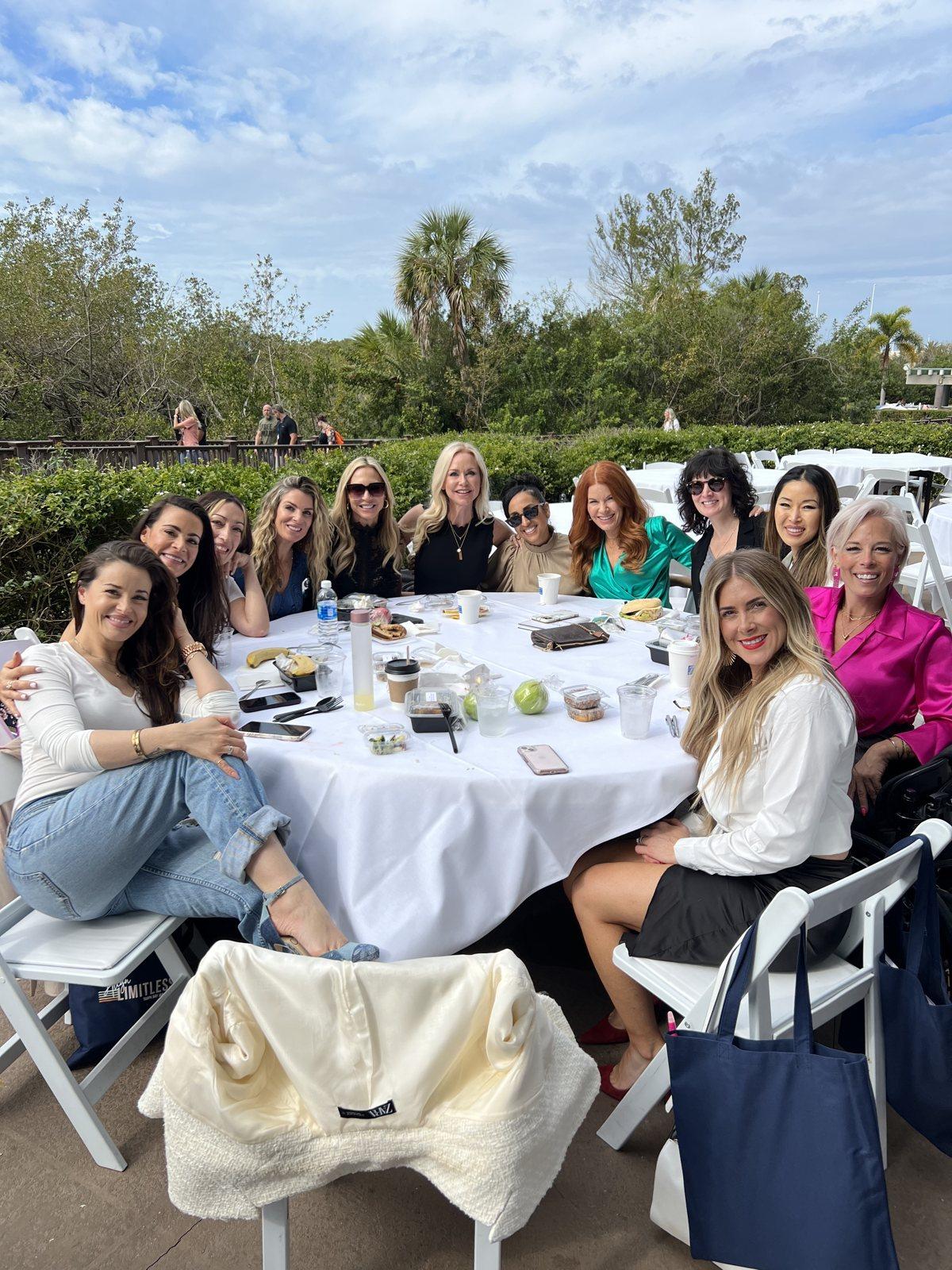 Women gathered around a table at an Amberly Lago retreat